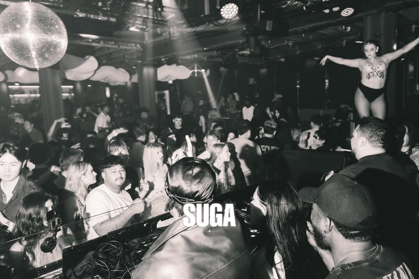 A performer and the crowd at SUGA